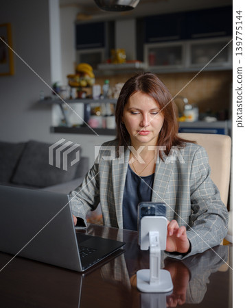 Remote Working Mother Balancing Home and Career Remote Working Mother Balancing Home and Career 139775144