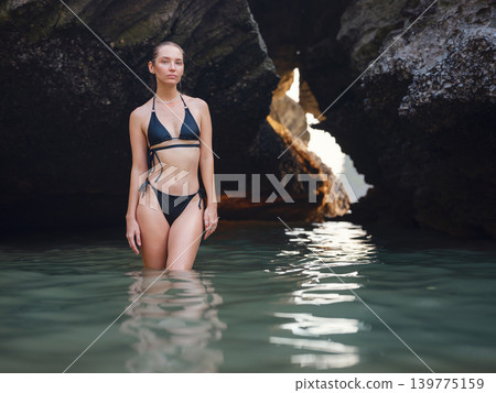Young woman enjoying serene evening at sea in Krabi, Thailand Young woman enjoying serene evening at sea in Krabi, Thailand 139775159