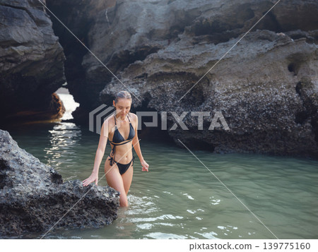 Young woman enjoying serene evening at sea in Krabi, Thailand Young woman enjoying serene evening at sea in Krabi, Thailand 139775160