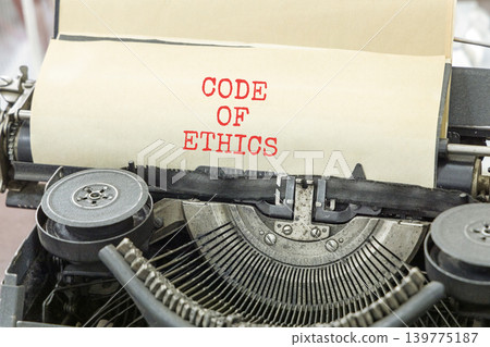 Code of ethics words symbol. Concept words Code of ethics typed on beautiful old retro typewriter. Beautiful white background. Business Code of ethics concept. Copy space. Code of ethics words symbol. Concept words Code of ethics typed on beautiful old retro typewriter. Beautiful white background. Business Code of ethics concept. Copy space. 139775187