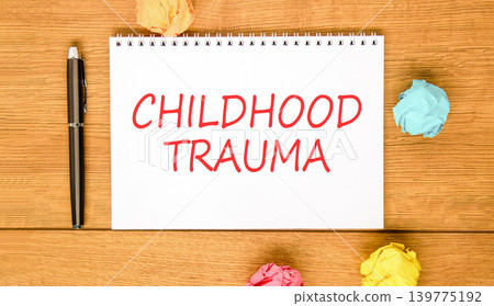 Childhood trauma words symbol. Concept words Childhood trauma on beautiful white note. Beautiful wooden background. Black pen. Colored paper. Psychological childhood trauma support concept. Copy space Childhood trauma words symbol. Concept words Childhood trauma on beautiful white note. Beautiful wooden background. Black pen. Colored paper. Psychological childhood trauma support concept. Copy space 139775192