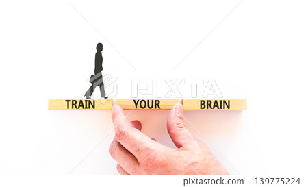 Train your brain words symbol. Concept words Train your brain on beautiful wooden blocks. Beautiful white background. Businessman hand. Business motivational and train your brain concept. Copy space Train your brain words symbol. Concept words Train your brain on beautiful wooden blocks. Beautiful white background. Businessman hand. Business motivational and train your brain concept. Copy space 139775224