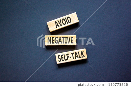 Avoid negative self-talk symbol. Concept words Avoid negative self-talk on beautiful wooden blocks. Beautiful black background. Business psychology avoid negative self-talk concept. Copy space. Avoid negative self-talk symbol. Concept words Avoid negative self-talk on beautiful wooden blocks. Beautiful black background. Business psychology avoid negative self-talk concept. Copy space. 139775226
