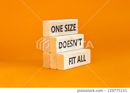 One size does not fit all symbol. Concept words One size does not fit all on beautiful wooden blocks. Beautiful orange background. Business one size does not fit all concept. Copy space. One size does not fit all symbol. Concept words One size does not fit all on beautiful wooden blocks. Beautiful orange background. Business one size does not fit all concept. Copy space. 139775231