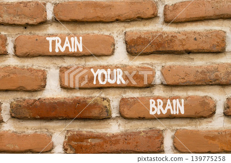 Train your brain words symbol. Concept words Train your brain on beautiful brown brick wall. Beautiful brown brick wall background. Business motivational and train your brain concept. Copy space. 139775258