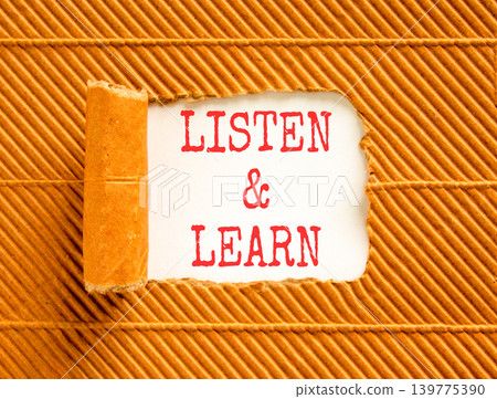 Listen and learn words symbol. Concept words Listen and learn on beautiful white paper. Beautiful brown background. Business listen and learn support concept. Copy space. Listen and learn words symbol. Concept words Listen and learn on beautiful white paper. Beautiful brown background. Business listen and learn support concept. Copy space. 139775390