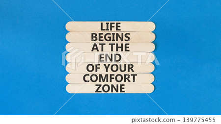 Leave your comfort zone symbol. Concept words Life begins at the end of your comfort zone on beautiful wooden stick. Beautiful blue background. Psychological Leave comfort zone concept. Copy space. Leave your comfort zone symbol. Concept words Life begins at the end of your comfort zone on beautiful wooden stick. Beautiful blue background. Psychological Leave comfort zone concept. Copy space. 139775455