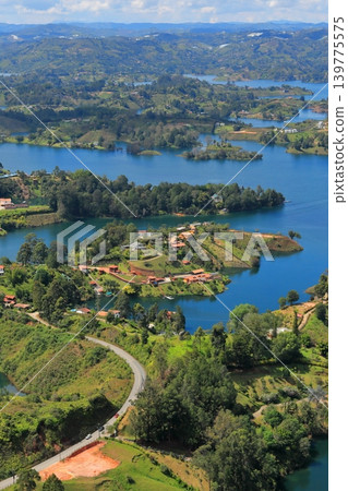 The breathtaking scenery and emerald green waters of Lake Guatapé, a hidden gem in Colombia, South America. The breathtaking scenery and emerald green waters of Lake Guatapé, a hidden gem in Colombia, South America. 139775575