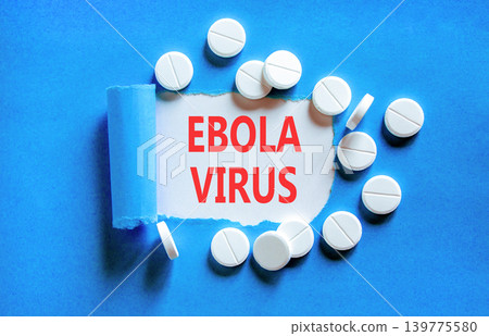 Ebola virus medical words symbol. Concept words Ebola virus on beautiful white paper. Beautiful blue background. Beautiful white pills. Medical Ebola virus concept. Copy space. Ebola virus medical words symbol. Concept words Ebola virus on beautiful white paper. Beautiful blue background. Beautiful white pills. Medical Ebola virus concept. Copy space. 139775580