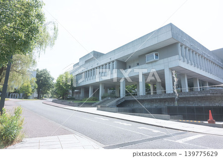 Sophisticated aesthetic beauty: The modern, exposed concrete exterior of the university building stands out against the blue sky. Sophisticated aesthetic beauty: The modern, exposed concrete exterior of the university building stands out against the blue sky. 139775629