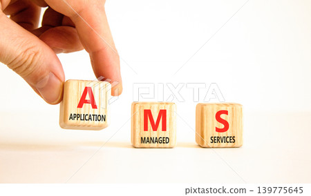 AMS application managed services symbol. Concept words AMS application managed services on beautiful wooden blocks. Businessman hand. Beautiful white background. Business AMS concept. Copy space. AMS application managed services symbol. Concept words AMS application managed services on beautiful wooden blocks. Businessman hand. Beautiful white background. Business AMS concept. Copy space. 139775645