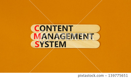 CMS content management system symbol. Concept words CMS content management system on beautiful wooden sticks. Beautiful orange background. Business CMS content management system concept. Copy space. 139775651