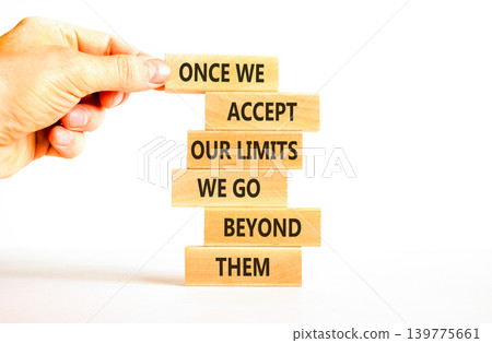 Beyond limits symbol. Concept words Once we accept our limits we go beyond them on wooden Sticks. Beautiful white background. Business Once we accept our limits we go beyond them concept. Copy space. Beyond limits symbol. Concept words Once we accept our limits we go beyond them on wooden Sticks. Beautiful white background. Business Once we accept our limits we go beyond them concept. Copy space. 139775661