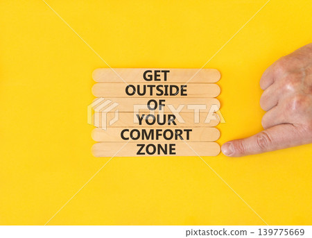 Leave your comfort zone symbol. Concept words Get outside of your comfort zone on beautiful wooden stick. Beautiful yellow background. Business psychological Leave comfort zone concept. Copy space. Leave your comfort zone symbol. Concept words Get outside of your comfort zone on beautiful wooden stick. Beautiful yellow background. Business psychological Leave comfort zone concept. Copy space. 139775669