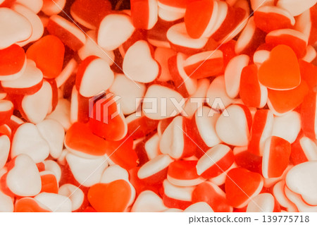 Gummies jelly sweet sugar marmalade white food candy red color background Gummies jelly sweet sugar marmalade white food candy red color background 139775718