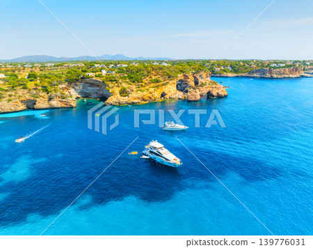 Aerial view of bay with yachts and boats. Balearic islands, Mallorca, Spain. Aerial view of bay with yachts and boats. Balearic islands, Mallorca, Spain. 139776031