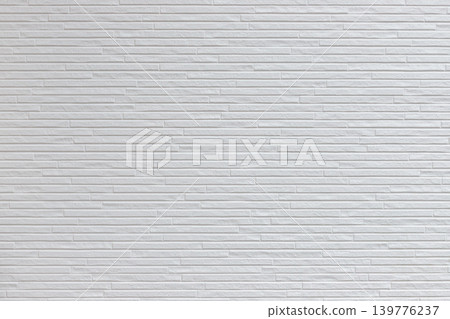 Simple textured background with a white brick-patterned wall. Simple textured background with a white brick-patterned wall. 139776237