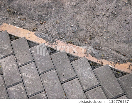 Laying Concrete Paving Stones on Gravel Laying Concrete Paving Stones on Gravel 139776387
