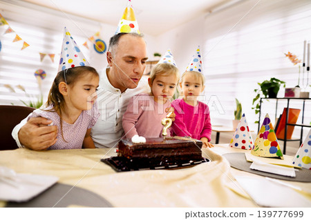 Celebration of joy during a festive birthday gathering in a cozy room Celebration of joy during a festive birthday gathering in a cozy room 139777699