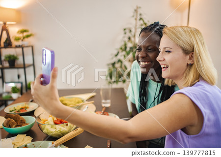 Friends sharing a joyful dinner together 139777815