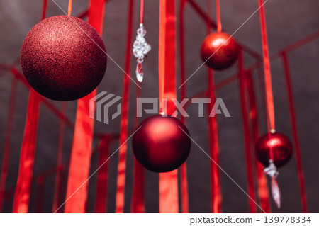 Beautiful Christmass and New Year decoration - red shiny ribbons and balls. 139778334