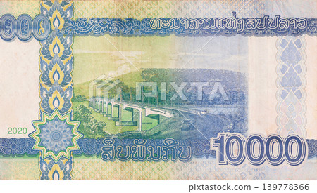 Officially validated Lao Kip currency 10000 denomination distributed by state bank of Laos rear view Officially validated Lao Kip currency 10000 denomination distributed by state bank of Laos rear view 139778366