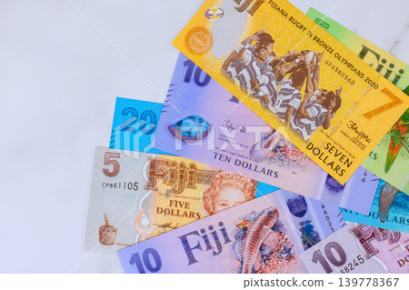 Multiple dollar bills of Fijian cash currency are placed with released reserve bank of Fiji Multiple dollar bills of Fijian cash currency are placed with released reserve bank of Fiji 139778367