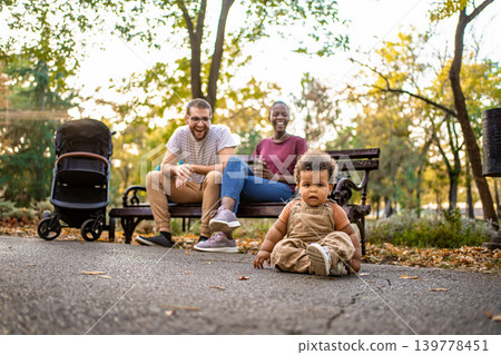 Joyful moments in the park with family and a curious toddler 139778451