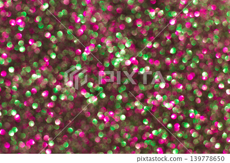 Abstract sparkle background. Shiny glitter bokeh in pink and green colors. Abstract sparkle background. Shiny glitter bokeh in pink and green colors. 139778650