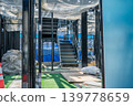 Horizontal net installed under the beams of the steel frame construction 139778659
