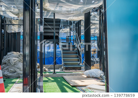 Horizontal net installed under the beams of the steel frame construction Horizontal net installed under the beams of the steel frame construction 139778659