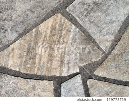 Natural-colored irregularly shaped stone pavement texture Natural-colored irregularly shaped stone pavement texture 139778739