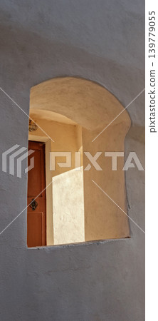 Arch Window View of Old Wooden Door 139779055