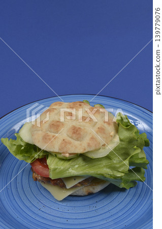Gourmet Meat Patty Sandwich on Blue Plate Gourmet Meat Patty Sandwich on Blue Plate 139779076