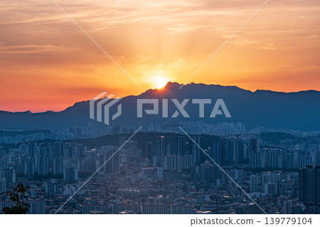 Breathtaking night view of Seoul cityscape and glowing city lights during blue hour twilight from Yongmasan Mountain, South Korea Breathtaking night view of Seoul cityscape and glowing city lights during blue hour twilight from Yongmasan Mountain, South Korea 139779104