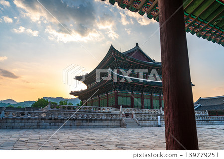 Seoul, South Korea - May. 17, 2026 : Majestic Geunjeongjeon Hall in Gyeongbokgung Palace glowing in intense sunset light, Seoul, South Korea 139779251