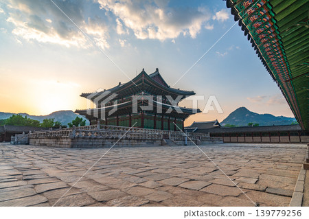 Seoul, South Korea - May. 17, 2026 : Majestic Geunjeongjeon Hall in Gyeongbokgung Palace glowing in intense sunset light, Seoul, South Korea Seoul, South Korea - May. 17, 2026 : Majestic Geunjeongjeon Hall in Gyeongbokgung Palace glowing in intense sunset light, Seoul, South Korea 139779256