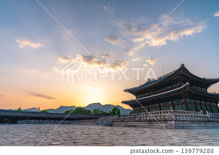 Seoul, South Korea - May. 17, 2026 : Majestic Geunjeongjeon Hall in Gyeongbokgung Palace glowing in intense sunset light, Seoul, South Korea Seoul, South Korea - May. 17, 2026 : Majestic Geunjeongjeon Hall in Gyeongbokgung Palace glowing in intense sunset light, Seoul, South Korea 139779288