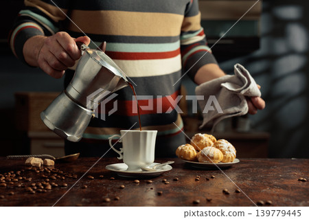 Profiteroles with mascarpone and cup of black coffee. Profiteroles with mascarpone and cup of black coffee. 139779445