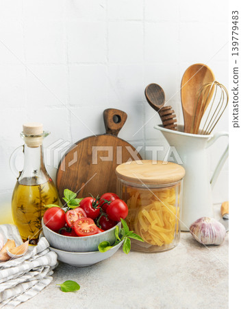 Cooking ingredients and kitchen utensils on counter Cooking ingredients and kitchen utensils on counter 139779483