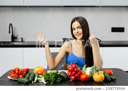 Young woman promoting healthy eating in kitchen Young woman promoting healthy eating in kitchen 139779504