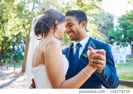 Dance, holding hands and couple at wedding outdoor for marriage, love or smile in nature. Bride, groom and people with affection, partner and support with connection, trust and peace in park Dance, holding hands and couple at wedding outdoor for marriage, love or smile in nature. Bride, groom and people with affection, partner and support with connection, trust and peace in park 139779734