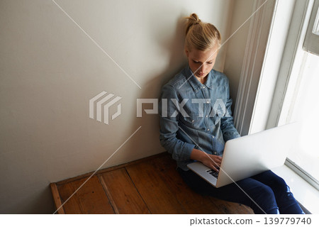 Woman, freelancer and laptop for blogging, remote work and internet connection on floor for info. Female person, editor and website for research or online news, writer and typing an article on tech Woman, freelancer and laptop for blogging, remote work and internet connection on floor for info. Female person, editor and website for research or online news, writer and typing an article on tech 139779740