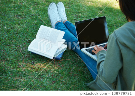 Study, book and person with laptop in park on campus for research, report and education at college. University, student and girl typing on computer with analysis of philosophy or reading on grass Study, book and person with laptop in park on campus for research, report and education at college. University, student and girl typing on computer with analysis of philosophy or reading on grass 139779781