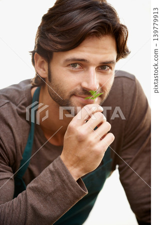 Mexican man, portrait and smelling plant for farming, gardening and agriculture by a white background. Farmer, studio and ecology for growth, produce and eco friendly harvest for future cultivation 139779913