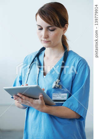 Research, tablet and woman nurse in hospital for medical diagnosis or treatment information. Professional, nursing and young female healthcare worker with digital technology in medicare clinic. 139779914