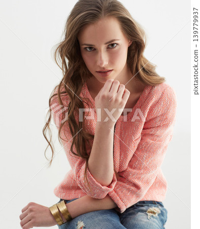 Woman, fashion and portrait in studio with confidence, style and pride in trendy jeans by white background. Isolated girl, person or model with edgy clothes, face or jewelry with sweater in Argentina Woman, fashion and portrait in studio with confidence, style and pride in trendy jeans by white background. Isolated girl, person or model with edgy clothes, face or jewelry with sweater in Argentina 139779937