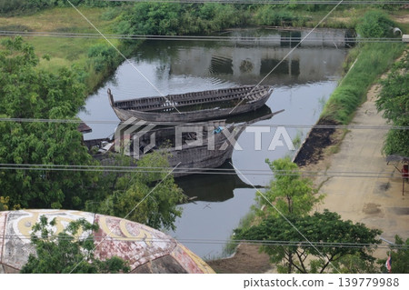 Old Boats in a Canal with Greenery Old Boats in a Canal with Greenery 139779988