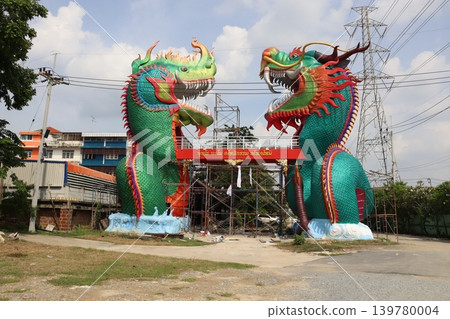 Two Colorful Dragon Statues in Urban Setting Two Colorful Dragon Statues in Urban Setting 139780004