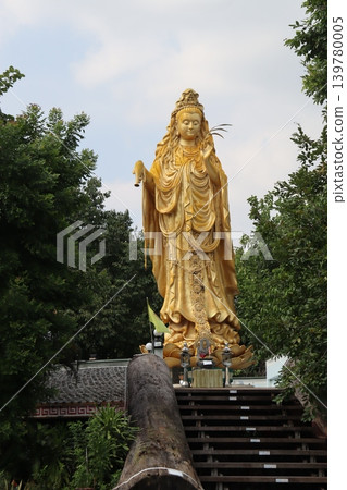 Golden Guanyin Statue in Outdoor Setting Golden Guanyin Statue in Outdoor Setting 139780005